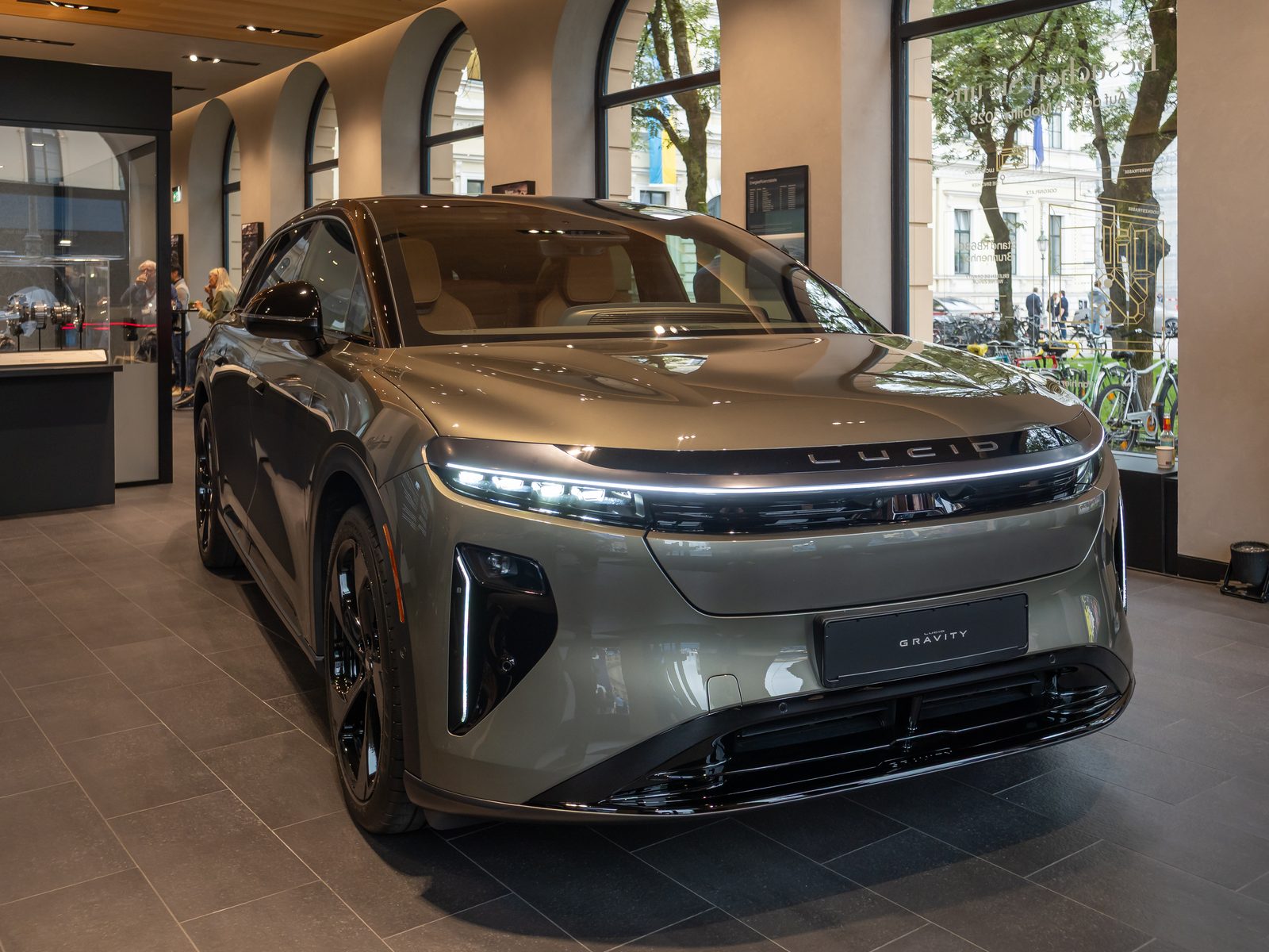 A Lucid Gravity SUV on a showroom floor.