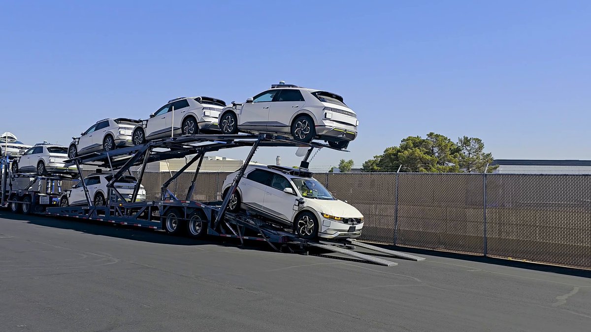 IONIQ 5 robotaxis on a car carrier at Motional's Las Vegas Technical Center, arriving from Singapore.