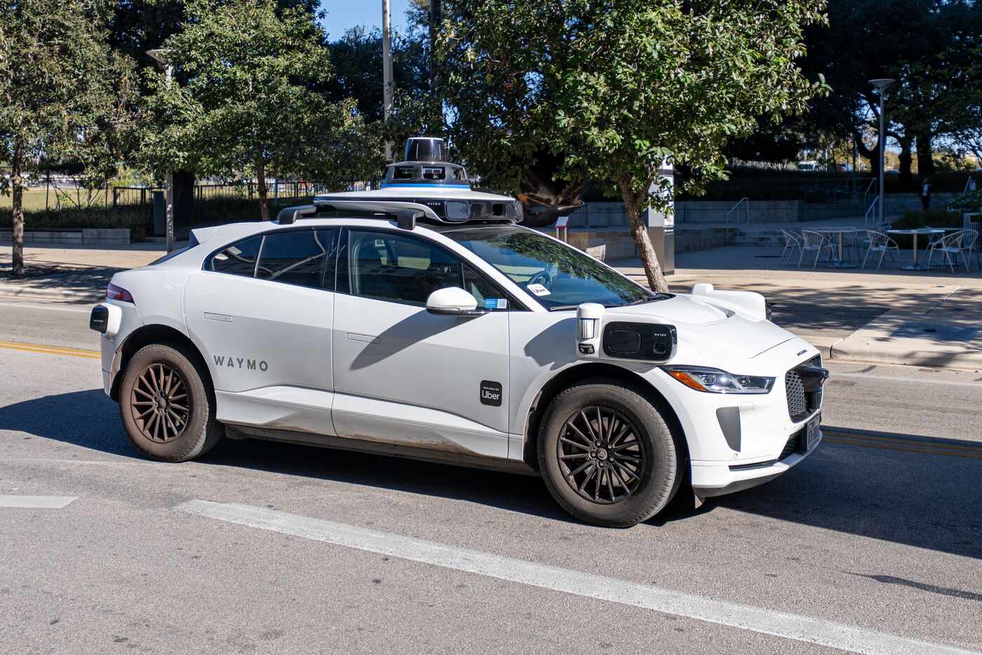 A Waymo robotaxi carrying Uber branding in Austin, Texas.