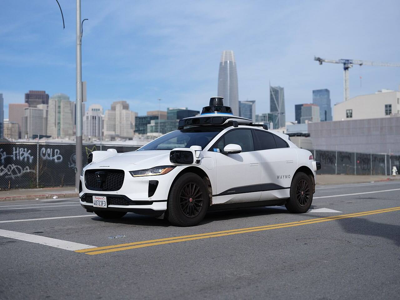 A Waymo Jaguar I-PACE on a U.S. street, used to illustrate the Singapore fleet.